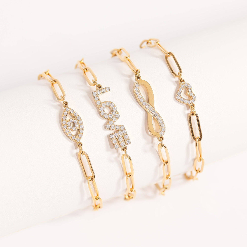 Three gold earrings with diamond accents on a white background